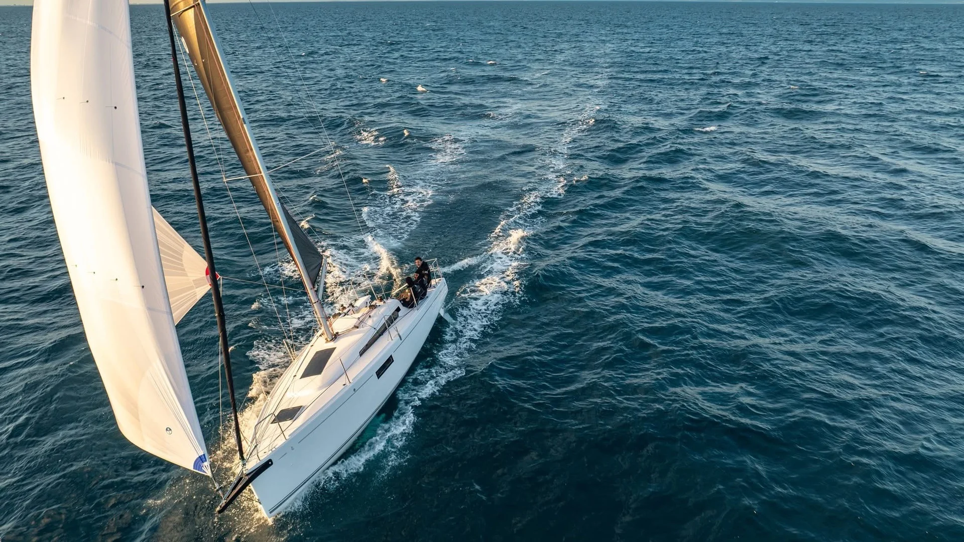 Beneteau sailing yacht cruising under sail on open water