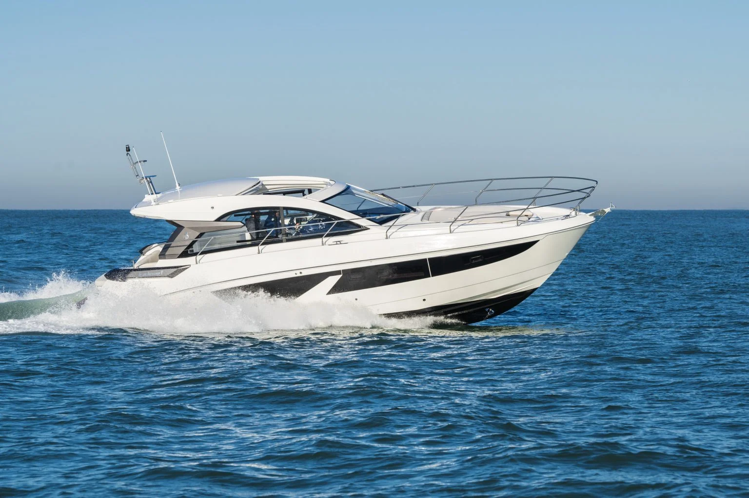 Beneteau Gran Turismo powerboat cruising at speed on open water