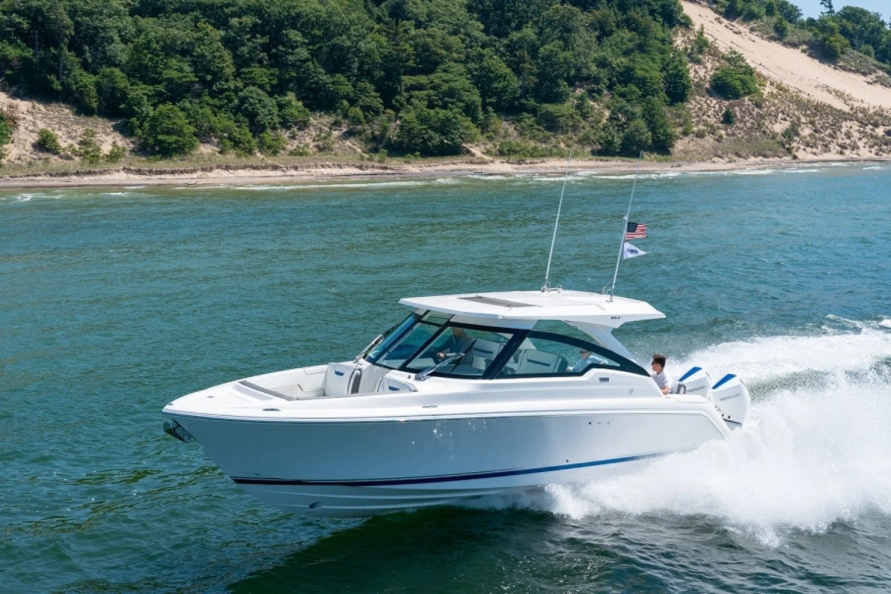 Tiara outboard yacht cruising at speed on the water