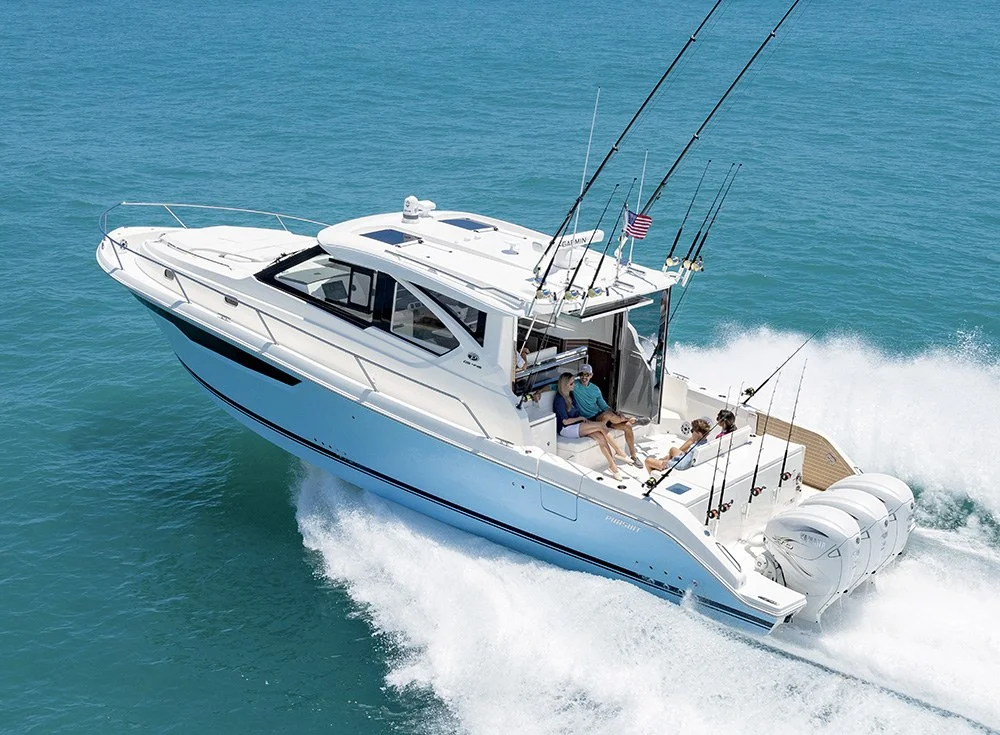 Pursuit Offshore boat cruising on open water