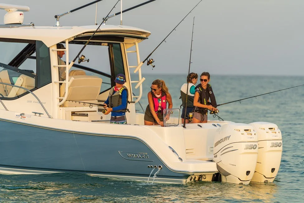 Family fishing from a Boston Whaler boat