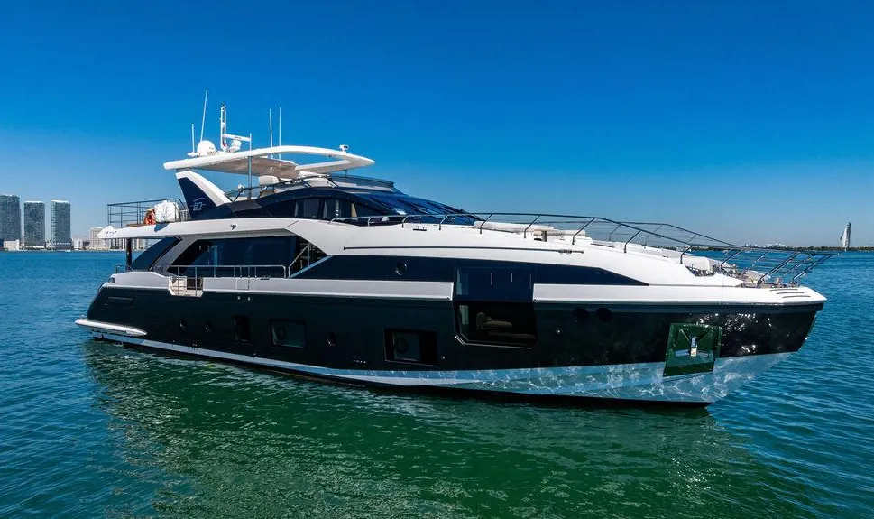 White luxury motor yacht cruising on open water